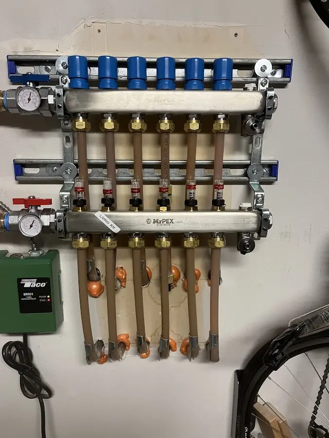 Plumber performing Water Heater Repair at a residential property in Millcreek